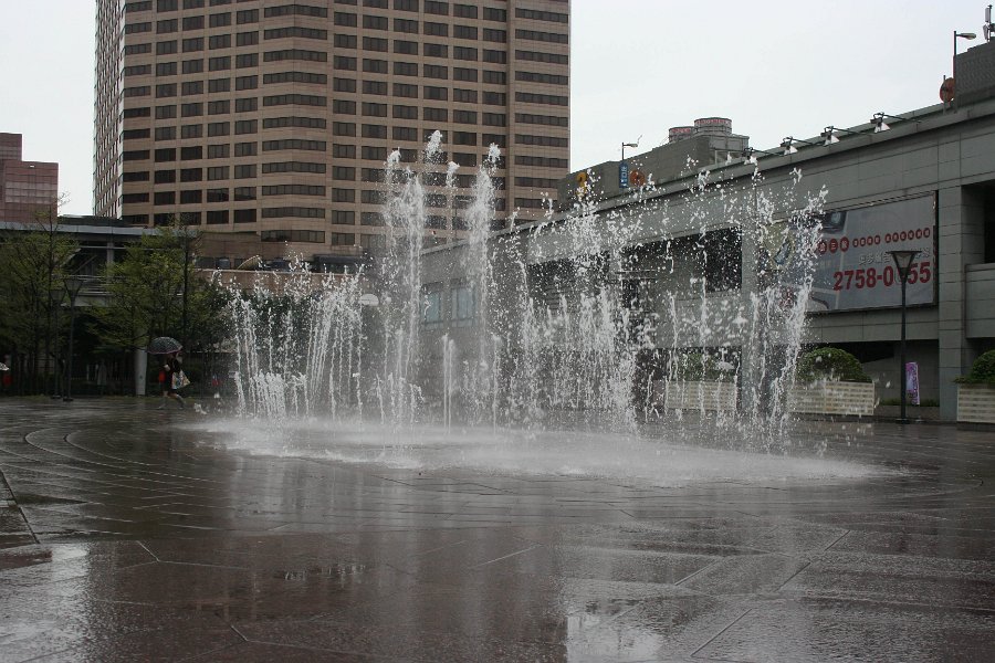 even though it was raining, they had their water fountain show on.